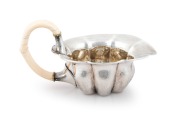 JOSEF HOFFMANN (1870-1956), WIENER WERKST&Auml;TTE stunning Austrian silver and ivory tea service, comprising a teapot, milk jug, sugar bowl, sugar tongs and tray, circa 1918. This model tea service was exhibited at the, Arts Decoratifs Et Industriels Modernes - 5