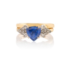373 · A 14ct gold ring, set with a 1.73ct natural corundum blue sapphire flanked by white diamonds, ​​​​​​​5.7 grams total.