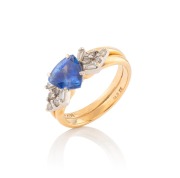 A 14ct gold ring, set with a 1.73ct natural corundum blue sapphire flanked by white diamonds, ​​​​​​​5.7 grams total. - 2