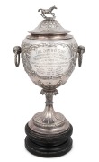 THE SPIRO CUP antique South African racing trophy, English sterling silver made in Birmingham, circa 1892, on ebonised timber plinth, 52cm high overall, 3300 grams total including base.