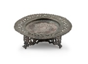 A Burmese silver dish on stand, 20th century, 5cm high, 13cm wide, 95 grams total.