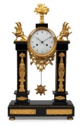 An antique French Empire pillar clock in black slate case with gilt metal mounts and decoration, eight day time and bell striking movement with silk suspension, circa 1820s, 56cm high.