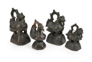 A set of four antique Burmese bronze weights, 19th/20th century, ​​​​​​​the largest 18cm high.