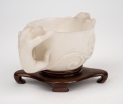 An antique Chinese carved mutton jade cup on later carved timber stand, Ming Dynasty, 6cm high, 13.5cm wide, 8cm high on stand. PROVENANCE: The Rod Thomas Collection, Melbourne. - 3