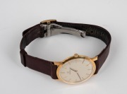 OMEGA vintage manual slimline gent's wristwatch in 18ct gold case with silvered dial and baton numerals, 3.2cm wide including crown. - 3