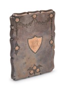 An antique English sterling silver calling card case, with applied 9ct rose gold floral decoration and ownership shield cartouche, made in Birmingham, circa 1870, 10cm high, 75 grams.