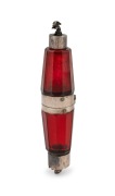 A handsome antique double ended faceted ruby glass scent bottle with figural rabbit and frog silver plated lids with unusual central hinge revealing a vinaigrette compartment, mid 19th century, 13cm long.