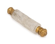 An antique Bohemian cut crystal double ended scent bottle with gilt metal tops, 19th century, 15cm long.