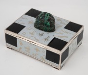 An Art Deco silver and enamel box with Chinese carved hardstone Buddha finial, interior with gold wash finish, circa 1920s, ​​​​​​​10.5cm wide, 351 grams total. - 2