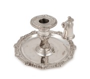 An antique sterling silver chamber stick and snuff with engraved crest, 18th/19th century, ​​​​​​​9cm high, 17cm wide, 326 grams total.