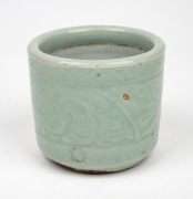 An antique Chinese celadon glazed brush pot, Qing Dynasty, 17th/18th century, 9.5cm high. ​​​​​​​PROVENANCE: The Rod Thomas Collection, Melbourne. - 2