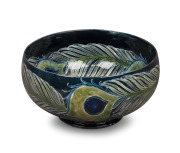 MOORCROFT stunning "Peacock Feather" pattern pottery bowl on dark blue ground developed at Cobridge in 1918, impressed "Moorcroft, Burslem", featured in the Paul Atterbury publication "Moorcroft Pottery A Guide To The Pottery Of William and Walter, 1897 