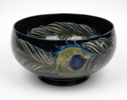 MOORCROFT stunning "Peacock Feather" pattern pottery bowl on dark blue ground developed at Cobridge in 1918, impressed "Moorcroft, Burslem", featured in the Paul Atterbury publication "Moorcroft Pottery A Guide To The Pottery Of William and Walter, 1897 - 3
