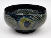MOORCROFT stunning "Peacock Feather" pattern pottery bowl on dark blue ground developed at Cobridge in 1918, impressed "Moorcroft, Burslem", featured in the Paul Atterbury publication "Moorcroft Pottery A Guide To The Pottery Of William and Walter, 1897 - 4