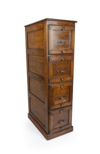 An antique oak four drawer filing cabinet with brass handles, drawers and sides with fully finished recessed panel construction, early 20th century, 148cm high, 42cm wide, 69cm deep.