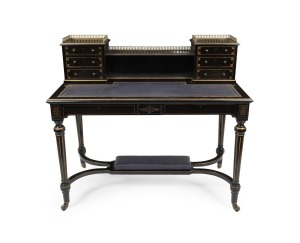 An antique English ebonised timber desk with gilt highlights and embossed blue leather top, attractively fitted with brass gallery back with six drawers, 19th century, 101cm high, 113cm wide, 62cm deep.