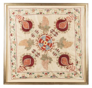 An Uzbek embroidered silk and cotton suzani, 20th century, attractively framed and mounted behind conservation glass 91 x 95cm overall.