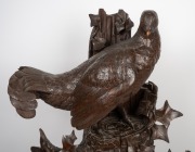 An antique German Black Forest carved timber mantle clock with game bird decoration, with period but replaced French eight day movement, 19th century, - 2