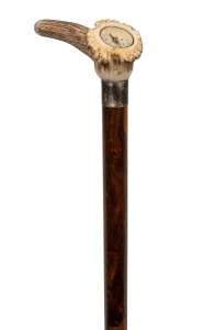 A vintage hardwood walking stick with deer antler handle, inset with a compass, silver collar and brass ferrule, 90cm high.