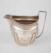 A Georgian sterling silver cream jug, (marks rubbed), early 19th century, ​​​​​​​10.5cm high, 126 grams.