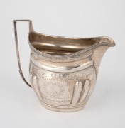 A Georgian sterling silver cream jug, (marks rubbed), early 19th century, ​​​​​​​10.5cm high, 126 grams. - 2