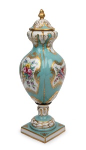 A vintage French porcelain lidded urn with hand-painted floral decoration on turquoise ground, 20th century, stamped "Porcelaine De Paris, France", 13cm high.