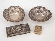 A pair of antique pierced silver dishes; together with a silver bobby pin box and a sterling silver vesta with gilt finish, 19th/20th century, (4 items), the box 10.5cm wide, 163 grams total.