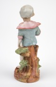 An antique Continental porcelain statue, 19th century, 12.5cm high. - 2
