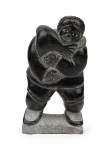 An Inuit carved stone statue, etched artist name "Kilopak" and official number, and bearing paper label "Canada Eskimo Art", 16.5cm high. Kilopak (Killupa Qinfali, born 1934, ws born in Akulivik, Quebec, Canada)
