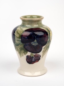 MOORCROFT "Pansy" miniature pottery vase on early celadon and cream ground, impressed "MOORCROFT, BURSLEM" with underglaze green signature "W. Moorcroft", 8.5cm high.