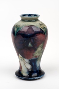 MOORCROFT "Pansy" miniature pottery vase on celadon and blue ground, impressed "MOORCROFT, BURSLEM", 9cm high.