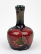 MOORCROFT "Pomegranate" miniature pottery vase on celadon/blue ground, impressed "MOORCROFT, BURSLEM", with early green underglazed signature mark, 9.5cm high.
