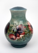 MOORCROFT "Anemone" pottery lamp base on blue/green ground, impressed "Moorcroft, Made In England" with remains of paper label, ​​​​​​​21cm high.