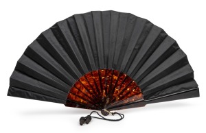 An antique tortoise shell and black silk fan, 19th century, ​​​​​​​33cm high, 59cm wide.