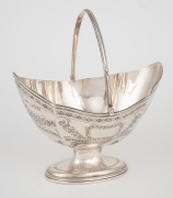 An antique English sterling silver sweet meat basket with engraved decoration, made in London, circa 1912, ​​​​​​​17cm high, 211 grams.