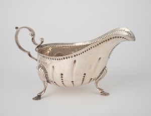 97 · An antique English sterling silver sauce boat, made in Birmingham, circa 1906 8.5cm high, 17cm wide, 144 grams.