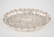 An antique English sterling silver oval dish with repousse decoration, made in Sheffield, circa 1895, ​​​​​​​24cm wide, 263 grams.