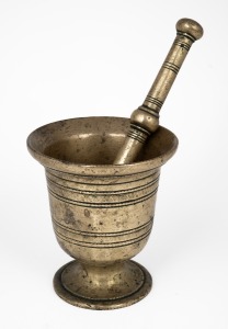 An antique brass mortar and pestle, 18th century, 13cm high.