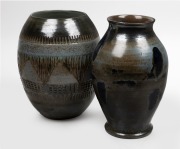 CHARLES WILTON barrel shaped pottery vase with unusual geometric motif; together with a green and blue glazed pottery vase, (2 items), both with incised signature to base, 29cm and 30cm high.