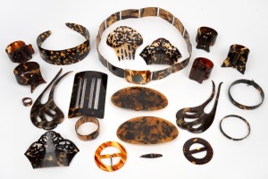 Assorted tortoise shell and celluloid items including napkin rings, hair combs, and hair band, buckles, belt etc, mixed vintages, 19th/20th century, (21 items),