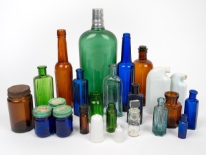 Assorted pharmaceutical bottles, jars etc., glass and ceramic, 19th and 20th century, (24 items), the largest 26cm high.