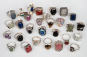 Twenty nine assorted silver rings with coloured stones, 220 grams total.