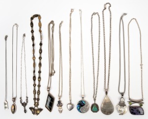 387 · Twelve assorted necklaces and pendants, mostly silver, 20th century.