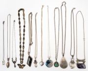 Twelve assorted necklaces and pendants, mostly silver, 20th century.