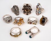 Nine assorted silver rings with stones, 20th century, ​​​​​​​95 grams total.