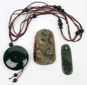 A New Zealand greenstone pendant, together with a Chinese jade and bead necklace on silk, and a Chinese carved jade dragon amulet, 19th/20th century, (3 items), the largest 6.2cm high.