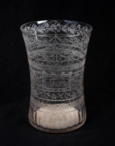 An antique Bohemian glass beaker with wheel cut engraved decoration, (A/F), 19th century, ​​​​​​​12cm high.