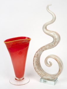 An art glass sculpture, together with a red art glass vase with yellow rim, 20th/21st century, (2 items), ​​​​​​​40cm and 23cm high.