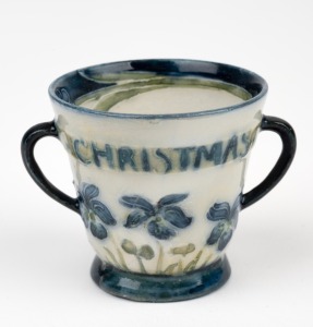 MACINTYRE MOORCROFT "Christmas Greetings" rare miniature pottery loving cup,. factory mark and green signature to base, 4cm high, 5.5cm wide.