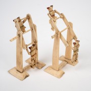 A pair of antique Chinese carved and painted bone acrobat toys, (A/F) late 19th century, 12cm high. - 2